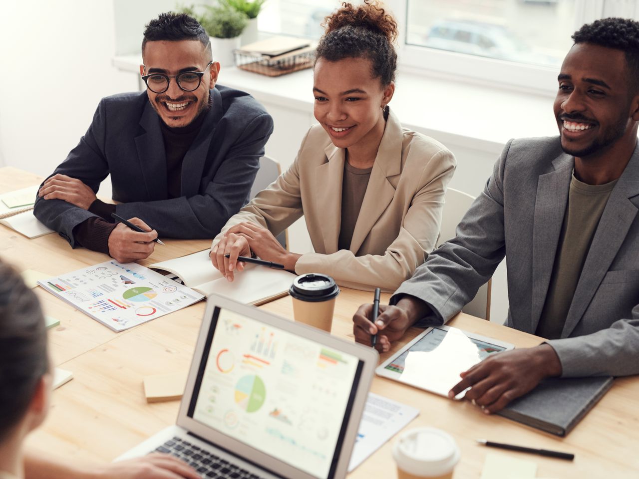 A marketing team discussing how digital marketing activities support business goals